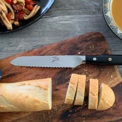 Alpha-Royal Japanese Serie 5,5" Allzweckmesser Wellen Damast-Stahl -Bestes Haushaltsgeräte Geschäft 10038997 de 0003 logo